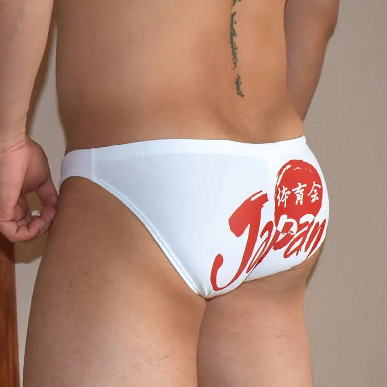a sexy man in white Men’s Nippon Jock Swim Briefs - pridevoyageshop.com - gay men’s sexy swim briefs, trunks, board shorts, and bikinis
