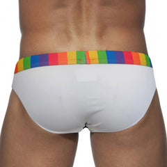 a sexy man in white Men’s Pride Patrol Rainbow Band Swim Briefs - pridevoyageshop.com - gay men’s sexy swim briefs, trunks, board shorts, and bikinis