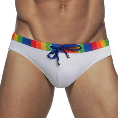 a sexy man in white Men’s Pride Patrol Rainbow Band Swim Briefs - pridevoyageshop.com - gay men’s sexy swim briefs, trunks, board shorts, and bikinis
