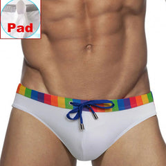 a sexy man in white Men’s Pride Patrol Rainbow Band Swim Briefs with pad - pridevoyageshop.com - gay men’s sexy swim briefs, trunks, board shorts, and bikinis