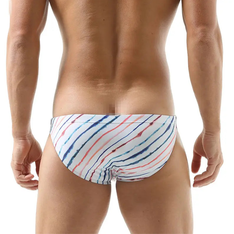a sexy man in white Men’s Rainbow Ripple Pride Swim Briefs - pridevoyageshop.com - gay men’s sexy swim briefs, trunks, board shorts, and bikinis