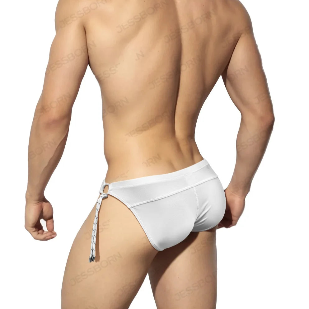 a sexy man in white Men's Rope Me Up Side Tether Swim Briefs - pridevoyageshop.com - gay men’s sexy swim briefs, trunks, board shorts, and bikinis
