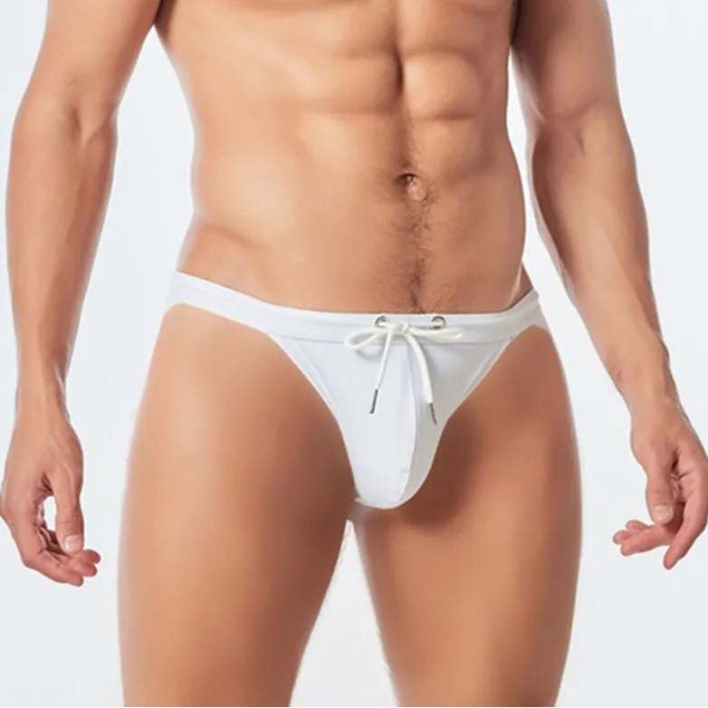 a sexy man in white Men’s Show Pony Drawstring Swim Briefs - pridevoyageshop.com - gay men’s sexy swim briefs, trunks, board shorts, and bikinis