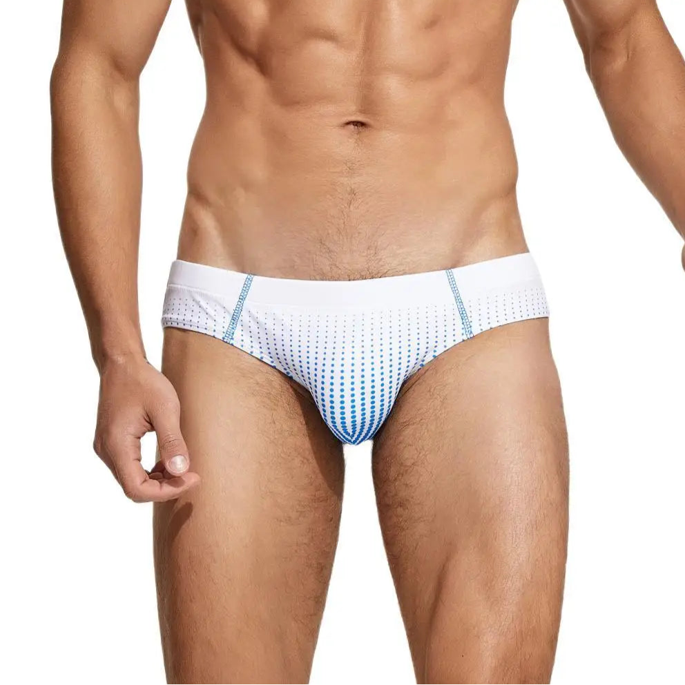 a sexy man in white Men’s Spank Me Dotty Swim Briefs - pridevoyageshop.com - gay men’s sexy swim briefs, trunks, board shorts, and bikinis