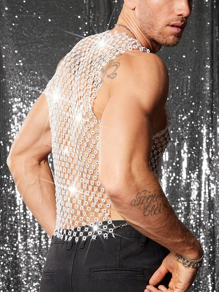 a sexy man in white crystal net tank revealing defined chest and shimmering rhinestones – pridevoyageshop.com – gay men’s harness, lingerie and fetish wear