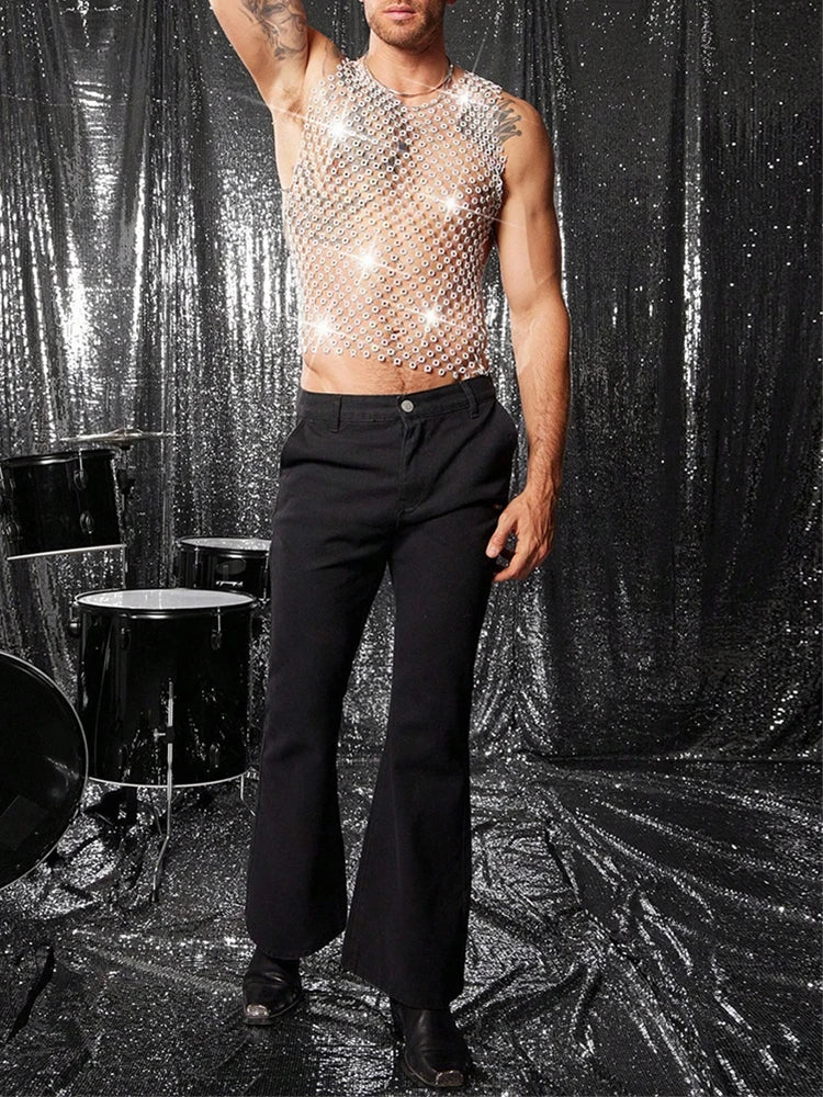 a sexy man in white crystal net tank revealing defined chest and shimmering rhinestones – pridevoyageshop.com – gay men’s harness, lingerie and fetish wear