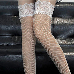 a sexy man in white lace-top snow veil fishnets showing toned legs and sensual soft aesthetic – pridevoyageshop.com – gay men’s harness, lingerie and fetish wear
