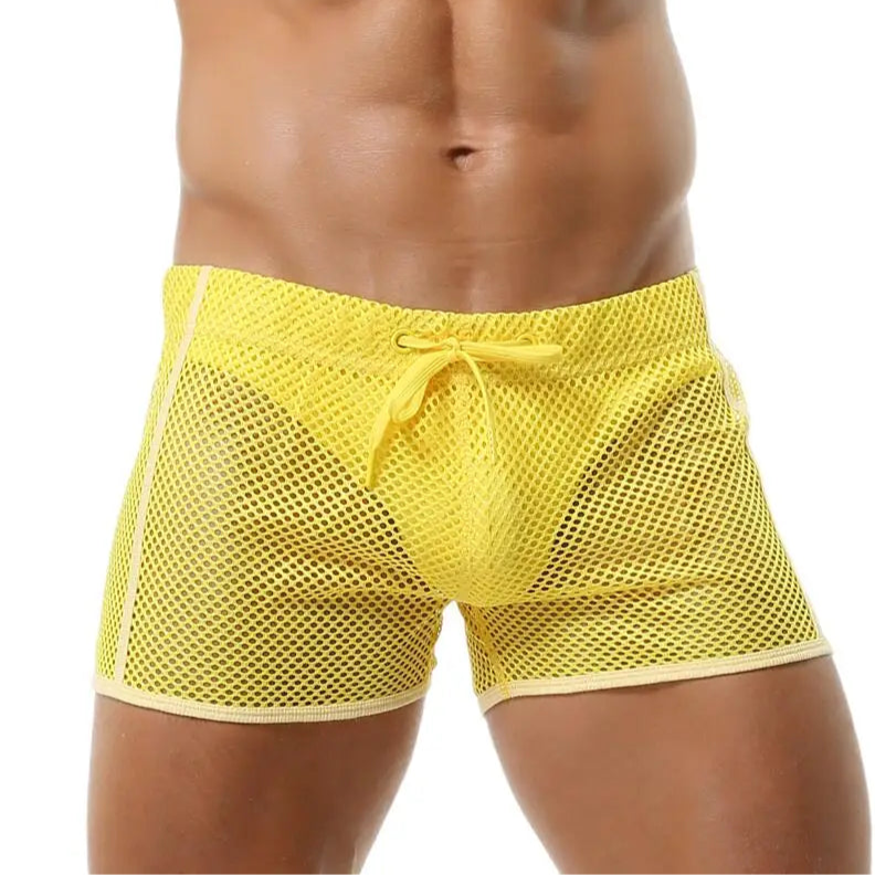 a sexy man in yellow Men’s Beacon Cruise Mesh Shorts – pridevoyageshop.com – gay men’s sexy swim briefs, trunks, board shorts, and bikinis