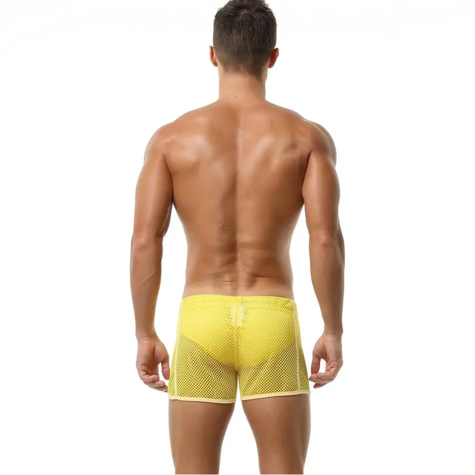 a sexy man in yellow Men’s Beacon Cruise Mesh Shorts – pridevoyageshop.com – gay men’s sexy swim briefs, trunks, board shorts, and bikinis