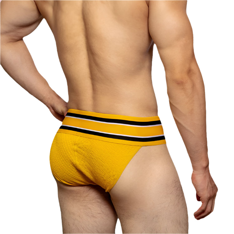 a sexy man in yellow Men’s D.M. Label Stripe Jock Briefs - pridevoyageshop.com - gay men’s thongs, boxers, briefs and jockstraps