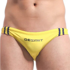 a sexy man in yellow Men’s Fast & Curious Skinny Swim Briefs - pridevoyageshop.com - gay men’s sexy swim briefs, trunks, board shorts, and bikinis