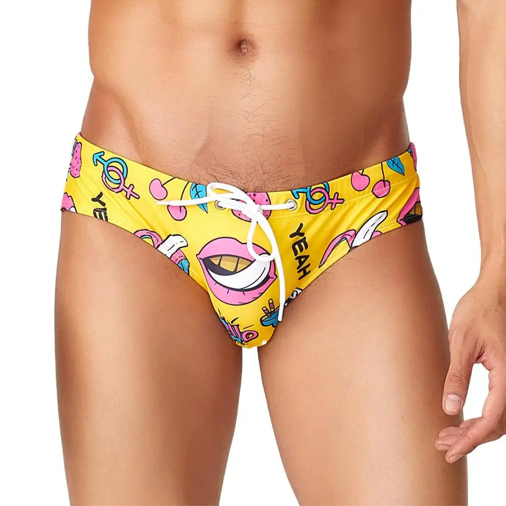 a sexy man in yellow Men’s Juicy Thirst Summer Swim Briefs - pridevoyageshop.com - gay men’s sexy swim briefs, trunks, board shorts, and bikinis