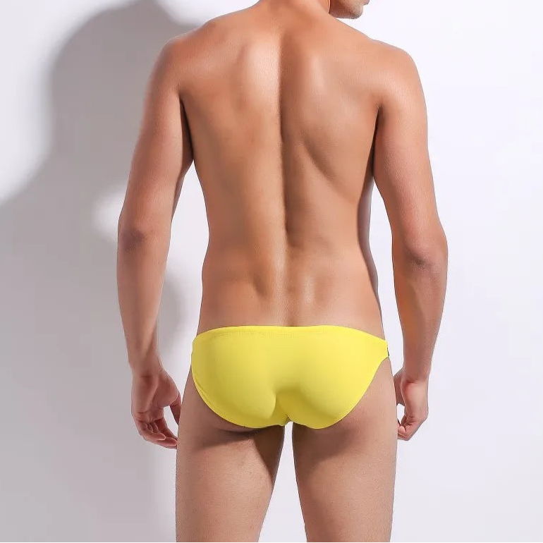 a sexy man in yellow Men’s Power Split Swim Briefs - pridevoyageshop.com - gay men’s sexy swim briefs, trunks, board shorts, and bikinis