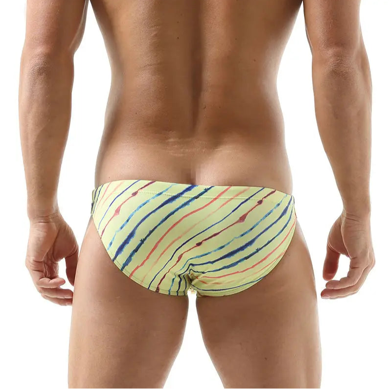 a sexy man in yellow Men’s Rainbow Ripple Pride Swim Briefs - pridevoyageshop.com - gay men’s sexy swim briefs, trunks, board shorts, and bikinis