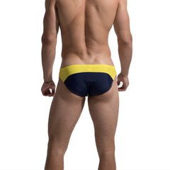 a sexy man in yellow Men’s Rival Jockline Bikini Swim Briefs - pridevoyageshop.com - gay men’s sexy swim briefs, trunks, board shorts, and bikinis