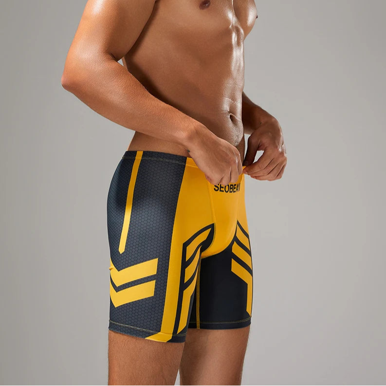a sexy man in yellow Men’s Volt Strike Vortex Compression Swim Shorts – pridevoyageshop.com – gay men’s sexy swim briefs, trunks, board shorts, and bikinis