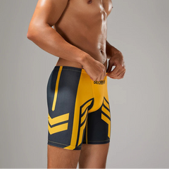 a sexy man in yellow Men’s Volt Strike Vortex Compression Swim Shorts – pridevoyageshop.com – gay men’s sexy swim briefs, trunks, board shorts, and bikinis