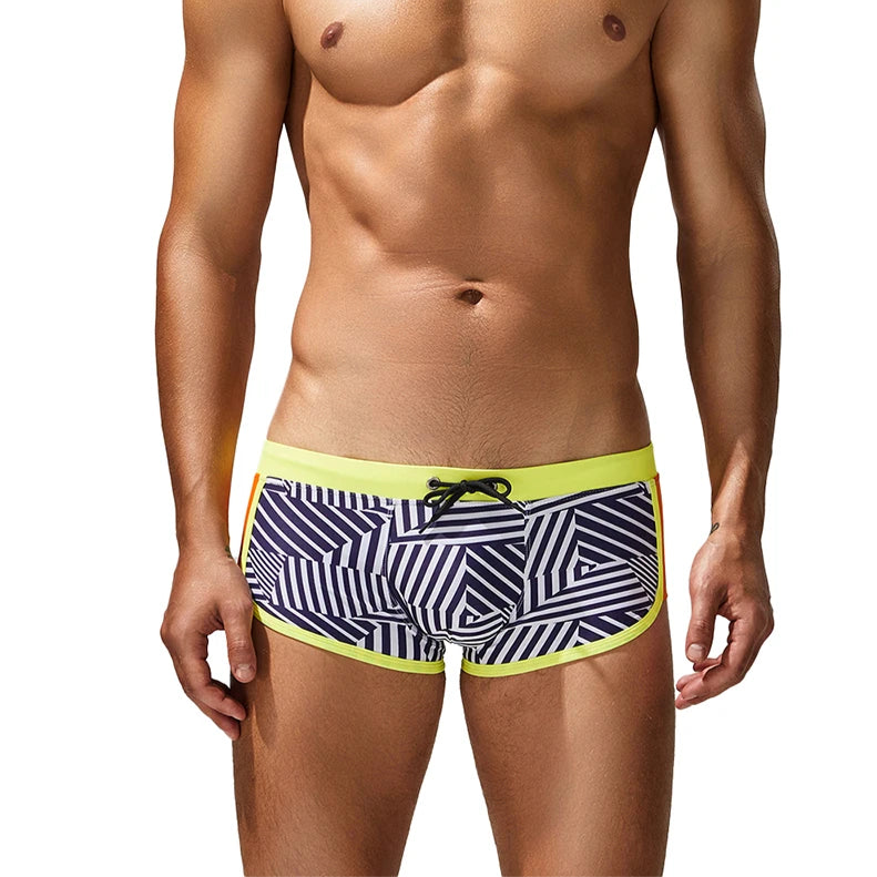a sexy man in yellow side SEOBEAN Men’s Obey the Stripe Low Rise Swim Trunks – pridevoyageshop.com – gay men’s sexy swim briefs, trunks, board shorts, and bikinis
