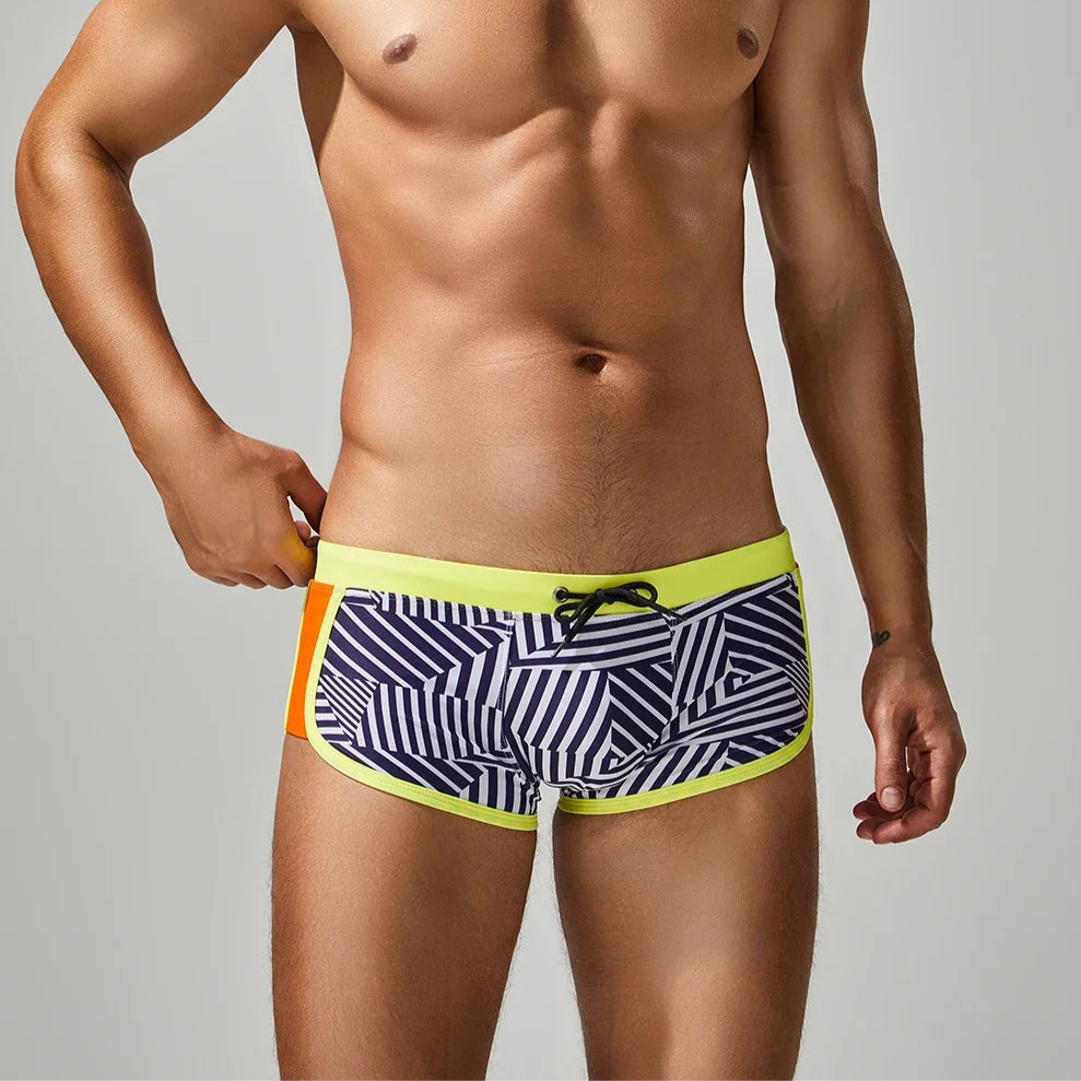 a sexy man in yellow side SEOBEAN Men’s Obey the Stripe Low Rise Swim Trunks – pridevoyageshop.com – gay men’s sexy swim briefs, trunks, board shorts, and bikinis