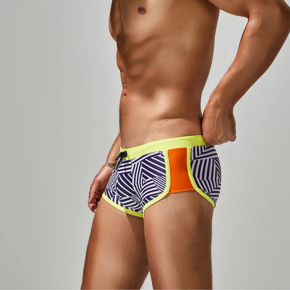 a sexy man in yellow side SEOBEAN Men’s Obey the Stripe Low Rise Swim Trunks – pridevoyageshop.com – gay men’s sexy swim briefs, trunks, board shorts, and bikinis