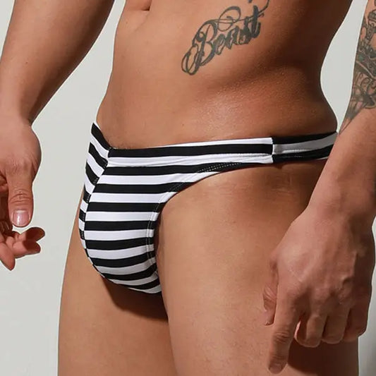 a sexy man in zebra stripes Men’s Cruising Bar Stripe Swim Bikini Thong – pridevoyageshop.com – gay men’s sexy swim briefs, trunks, board shorts, and bikinis