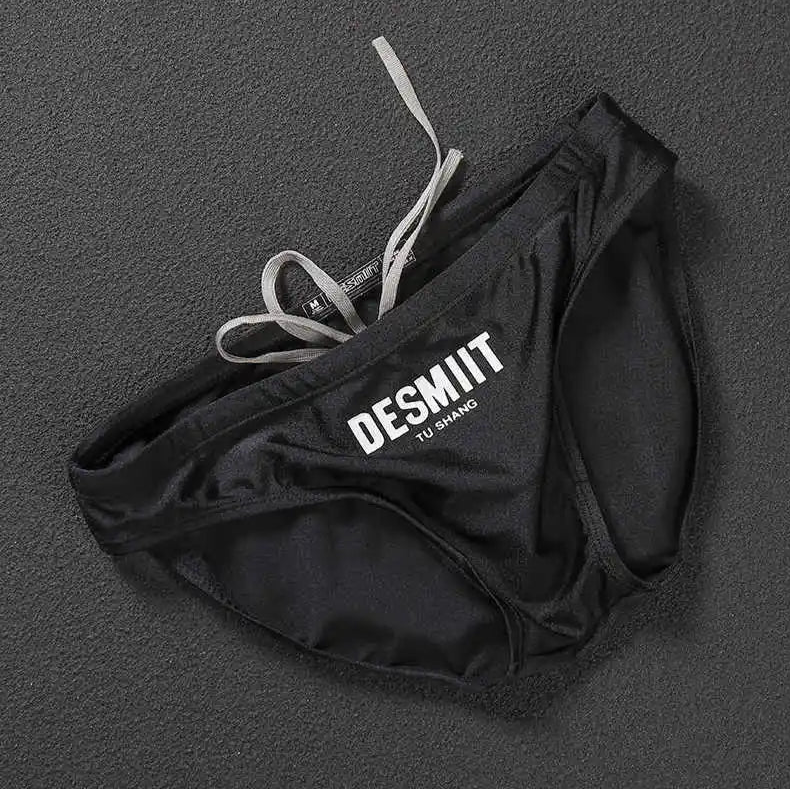 black Desmiit Men’s Sleek Statement Swim Briefs - pridevoyageshop.com - gay men’s sexy swim briefs, trunks, board shorts, and bikinis
