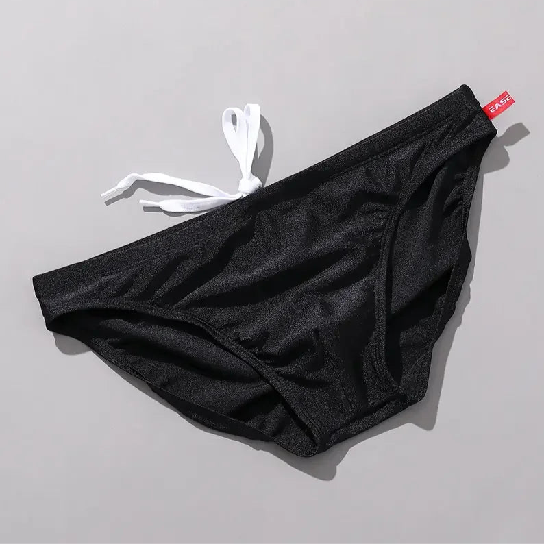 black Men’s Tease-Me Minimal Swim Briefs - pridevoyageshop.com - gay men’s sexy swim briefs, trunks, board shorts, and bikinis