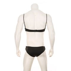 black lace Good Boy bralette and brief set flat lay, sheer floral lace, elastic trim, soft cupped top, cheeky bottoms – pridevoyageshop.com – gay men’s harness, lingerie and fetish wear