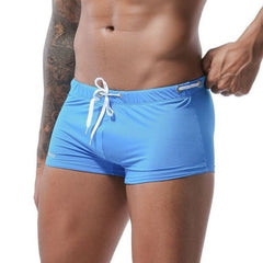 hot gay man in blue Gay Swimwear & Beachwear | Men's Bowtie Tight Swim Trunks - pridevoyageshop.com - gay men’s underwear and swimwear