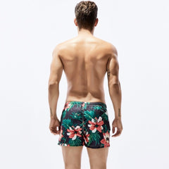 a hot man in dark Petal Play Board Shorts - pridevoyageshop.com - gay men’s underwear and swimwear