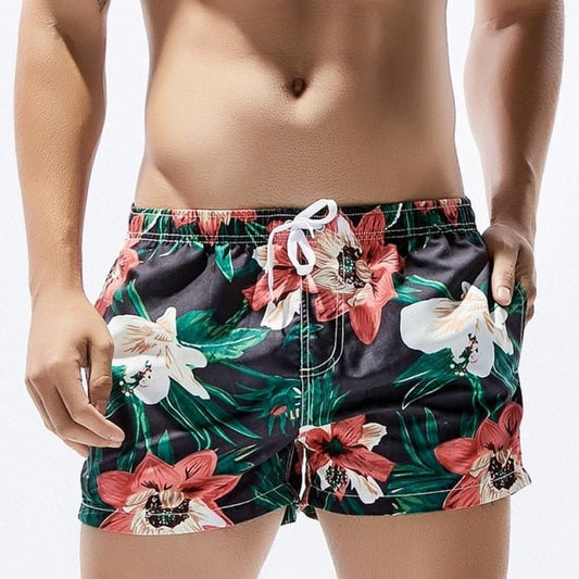 a hot man in dark Petal Play Board Shorts - pridevoyageshop.com - gay men’s underwear and swimwear