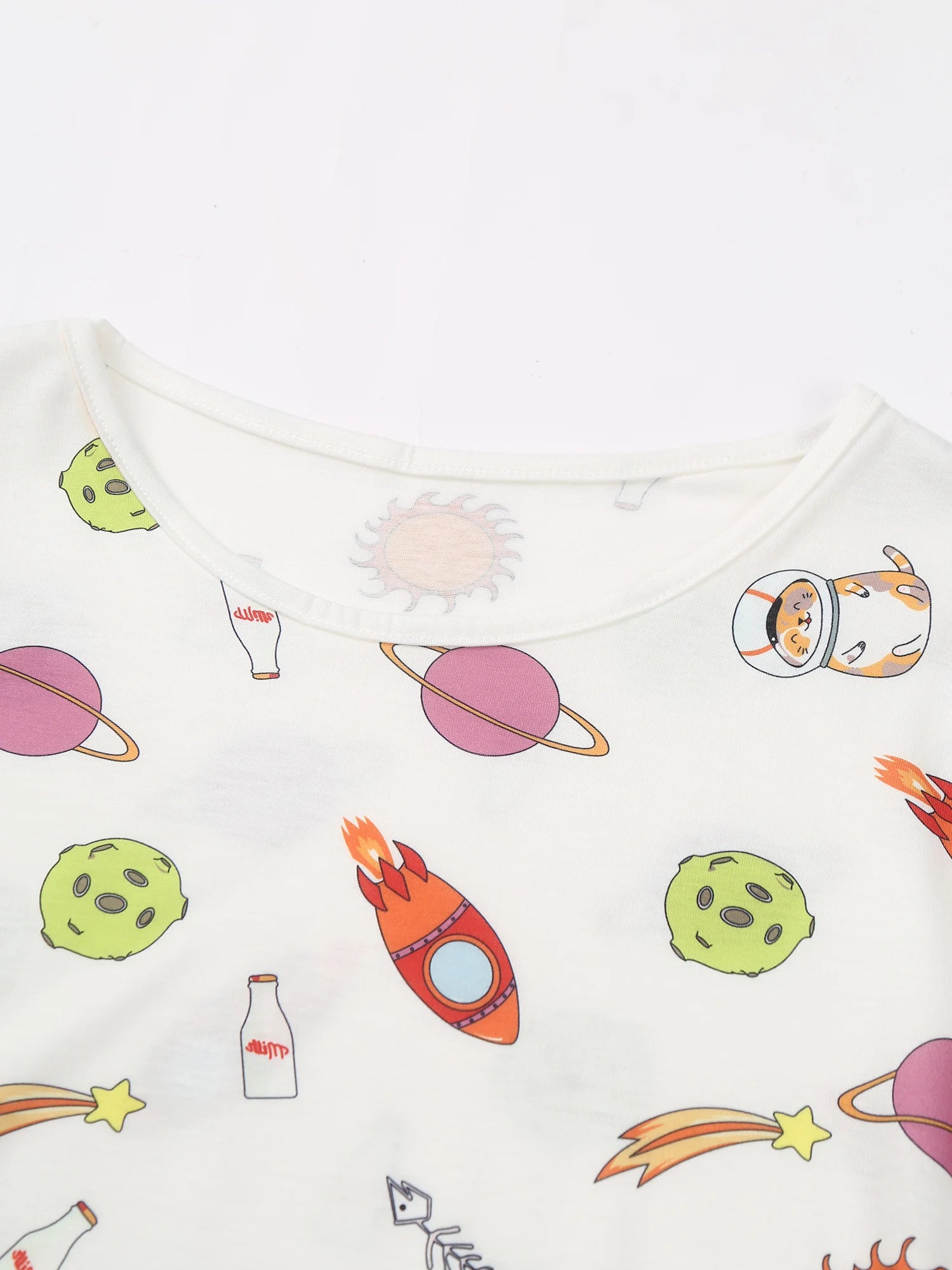details of Daddy’s Boy Printed Onesie flat lay, cosmic cartoon print, stretchy cute fabric, playful twink style – pridevoyageshop.com – gay men’s harness, lingerie and fetish wear