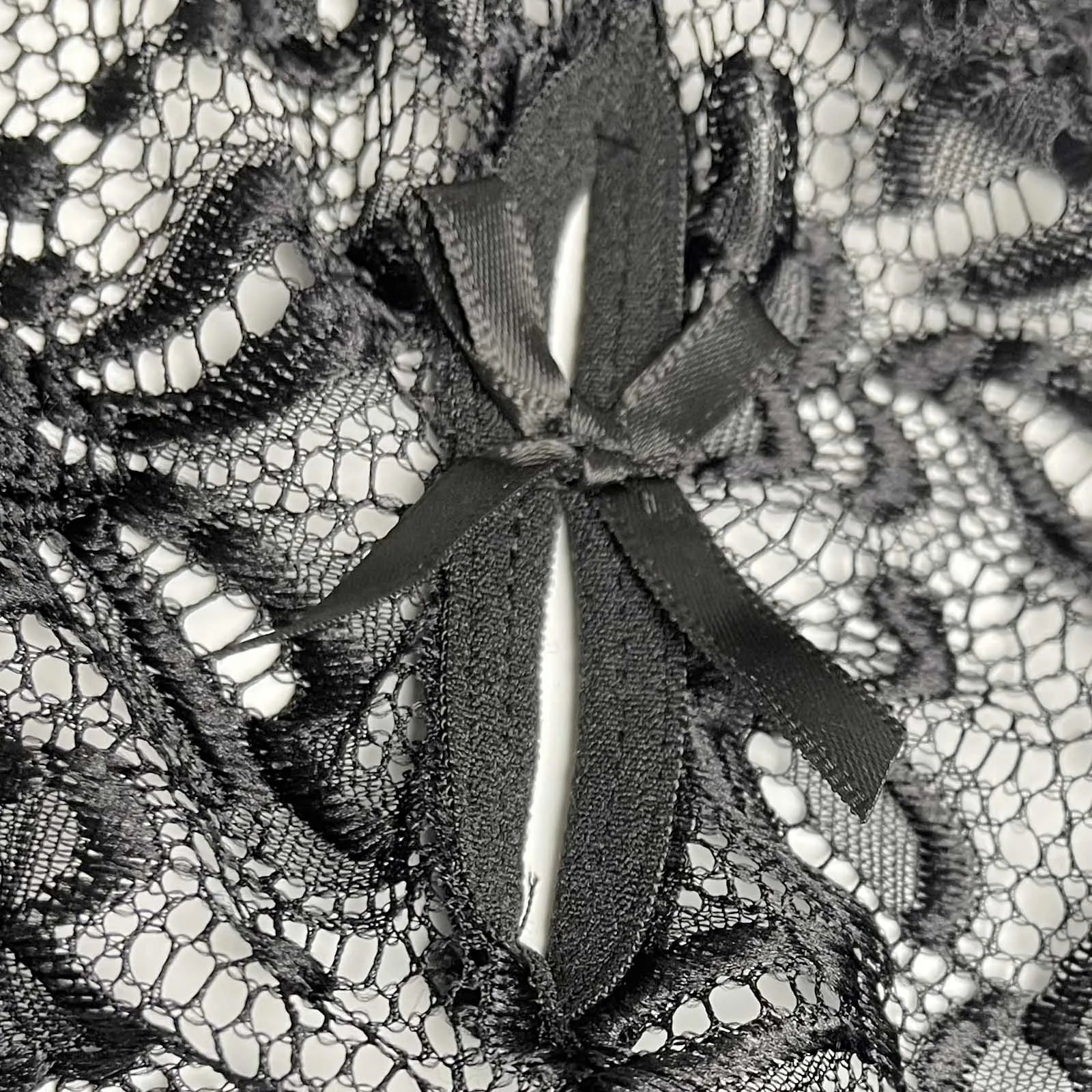 details of black Mother’s Boudoir Lace Teddy, floral lace fabric and deep neckline – pridevoyageshop.com – gay men’s harness, lingerie and fetish wear