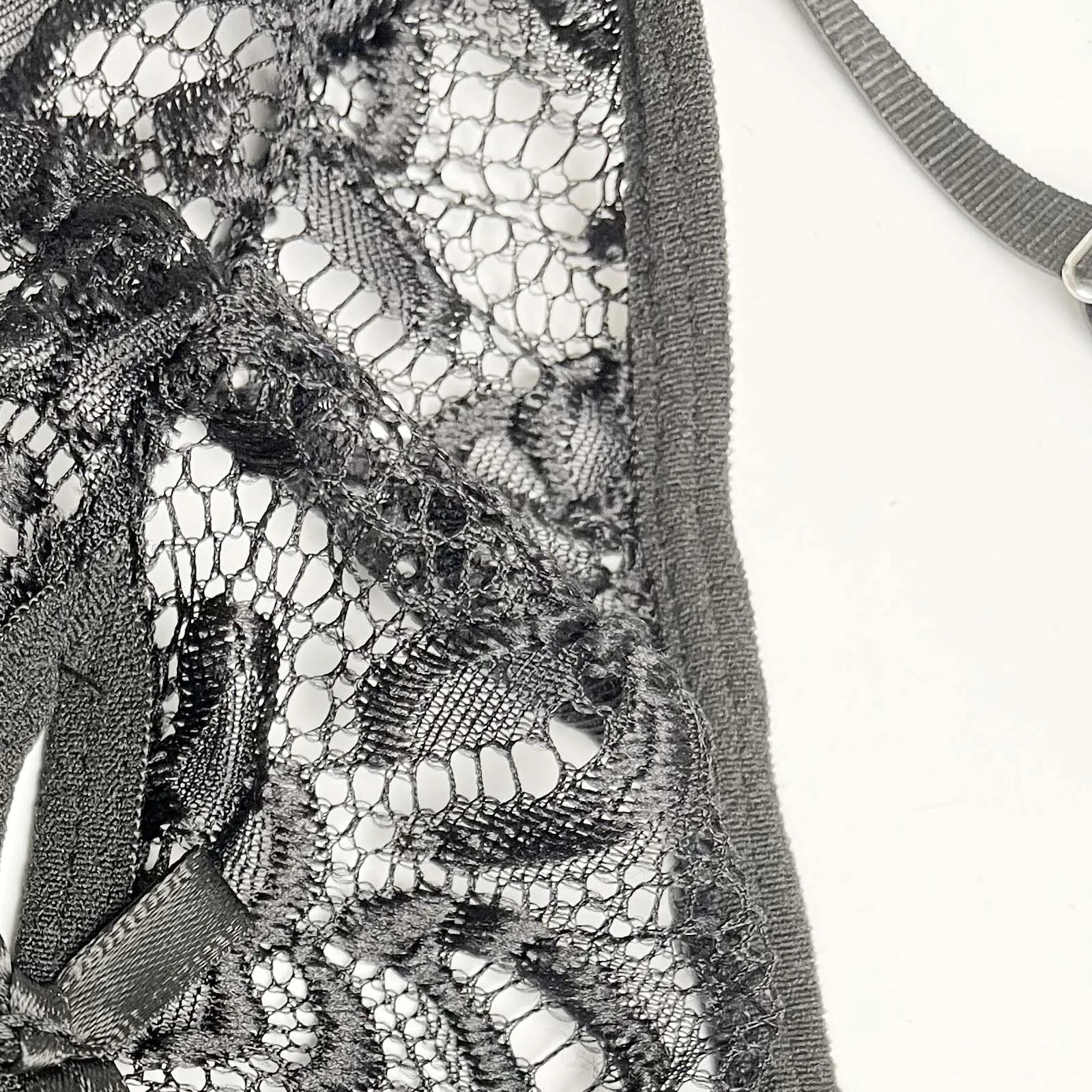 details of black Mother’s Boudoir Lace Teddy, floral lace fabric and deep neckline – pridevoyageshop.com – gay men’s harness, lingerie and fetish wear