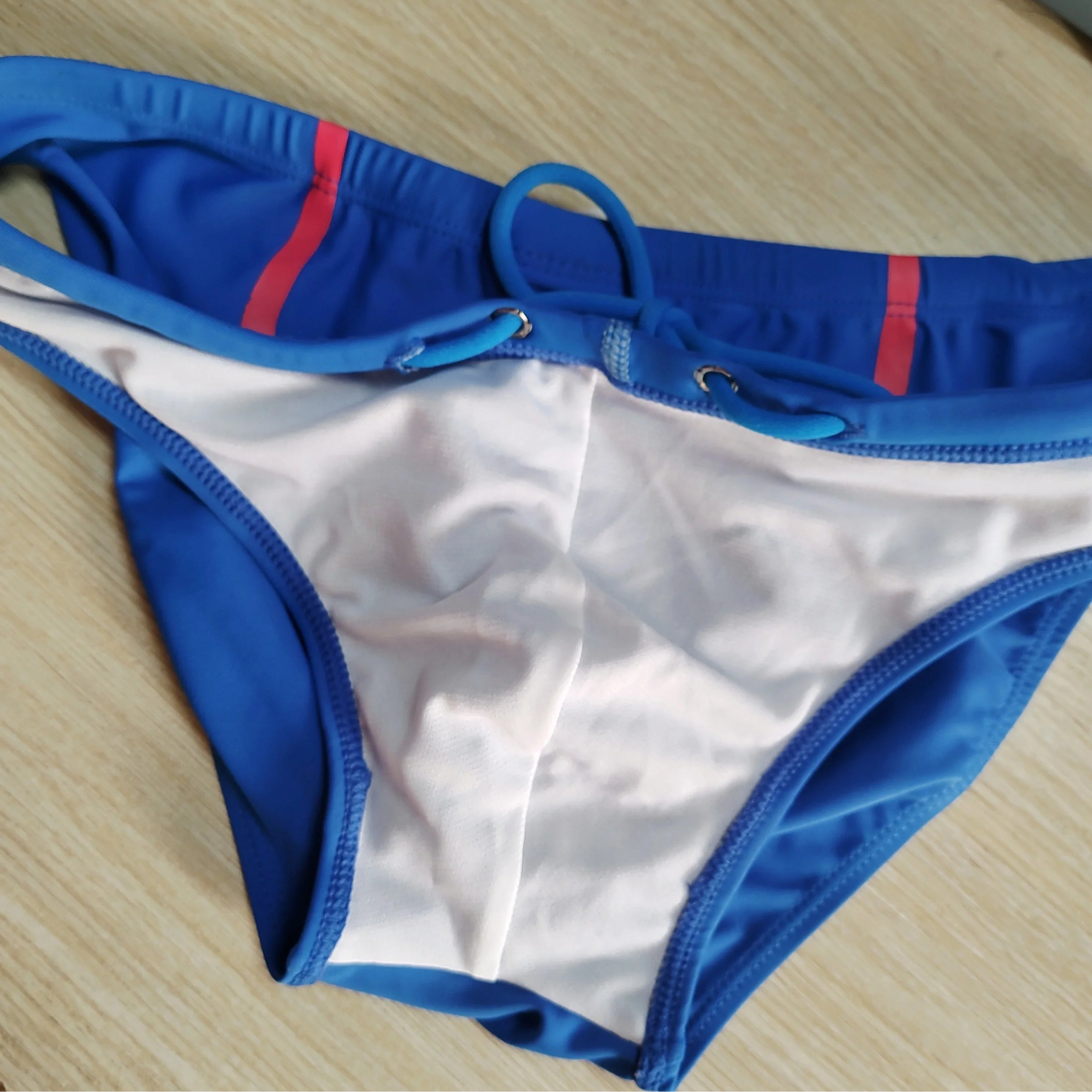 details of blue Men’s Bold Bulge Wave Swim Briefs - pridevoyageshop.com - gay men’s sexy swim briefs, trunks, board shorts, and bikinis