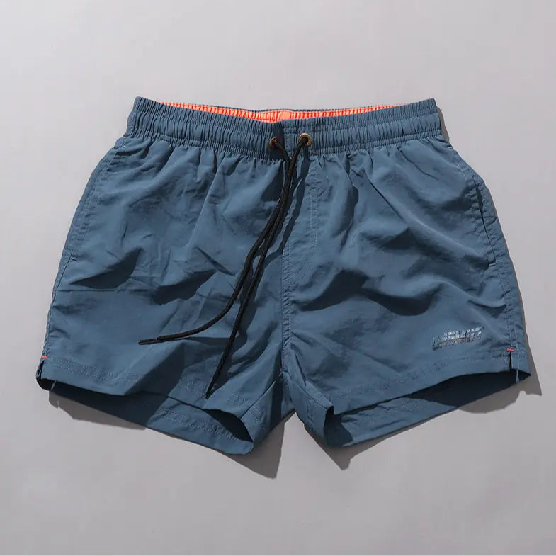 details of dark blue Desmiit Men’s Circuit Signal Swim Short – pridevoyageshop.com – gay men’s sexy swim briefs, trunks, board shorts, and bikinis