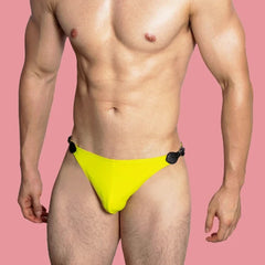 a sexy gay man in yellow VividFlash Leather Buckle Bikini Briefs - pridevoyageshop.com - gay men’s underwear and swimwear