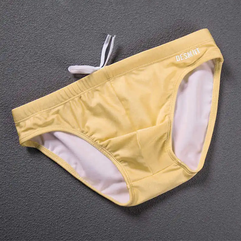 light yellow Desmiit Men’s Bulge Master Low Rise Swim Briefs - pridevoyageshop.com - gay men’s sexy swim briefs, trunks, board shorts, and bikinis
