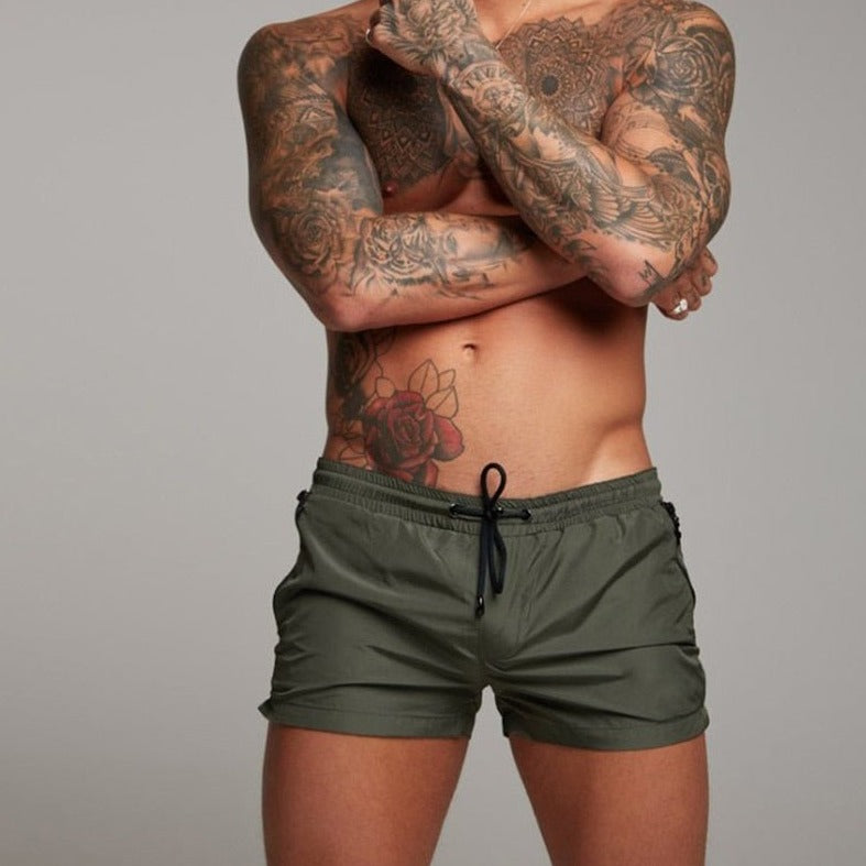 a hot gay man in army green Men's Solid Color Pocketed Running Shorts - pridevoyageshop.com - gay men’s underwear and swimwear