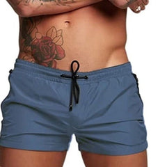 a hot gay man in gray Men's Solid Color Pocketed Running Shorts - pridevoyageshop.com - gay men’s underwear and swimwear