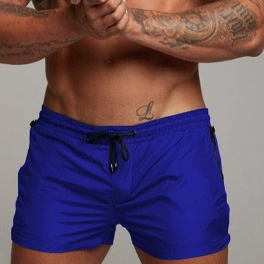a hot gay man in royal blue Men's Solid Color Pocketed Running Shorts - pridevoyageshop.com - gay men’s underwear and swimwear