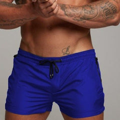 a hot gay man in royal blue Men's Solid Color Pocketed Running Shorts - pridevoyageshop.com - gay men’s underwear and swimwear