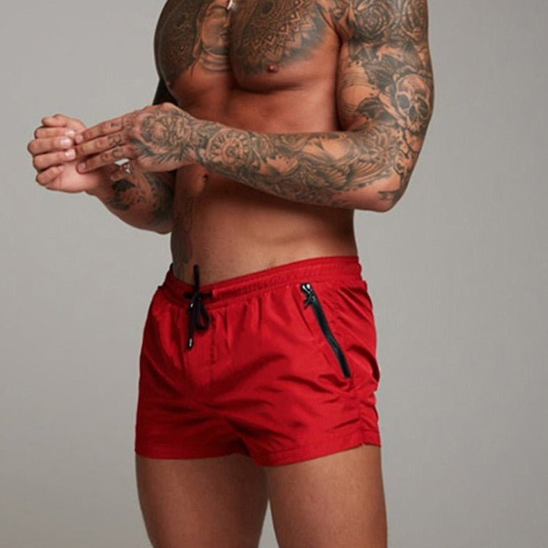 a hot gay man in red Men's Solid Color Pocketed Running Shorts - pridevoyageshop.com - gay men’s underwear and swimwear