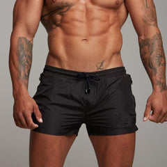 a hot gay man in black Men's Solid Color Pocketed Running Shorts - pridevoyageshop.com - gay men’s underwear and swimwear