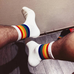 a sexy man in Rainbow Pride Crew Socks - pridevoyageshop.com - gay men's athletic socks, Pride rainbow crew socks
