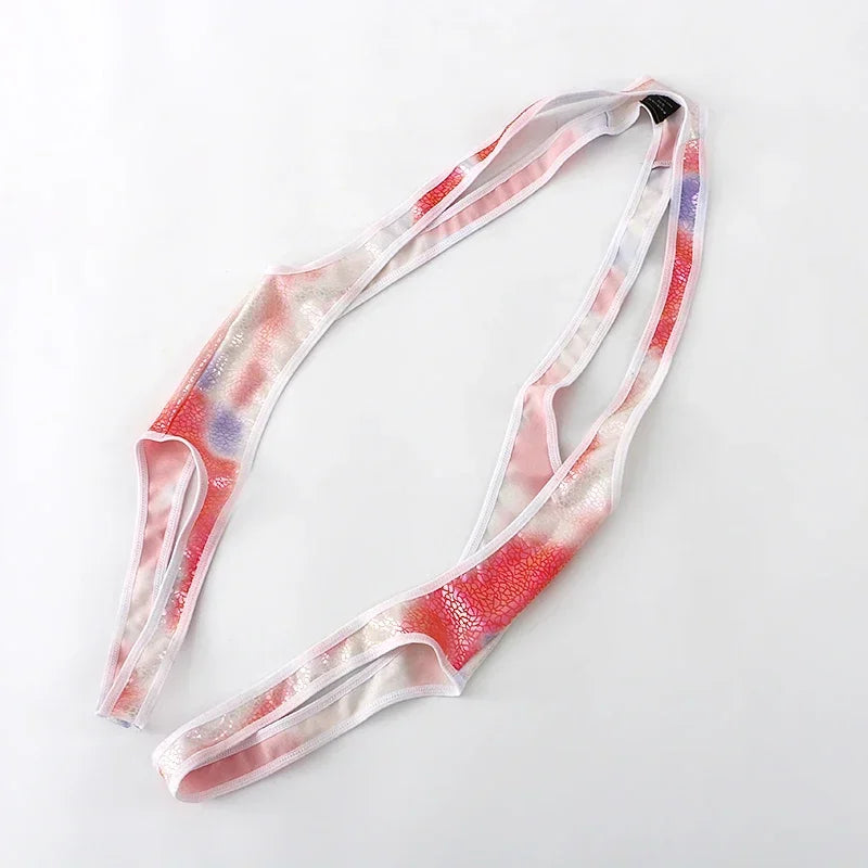 rainbow Riot Cage Frame Singlet flat-lay with pride color cage straps and athletic singlet silhouette – pridevoyageshop.com – gay men’s harness, lingerie and fetish wear