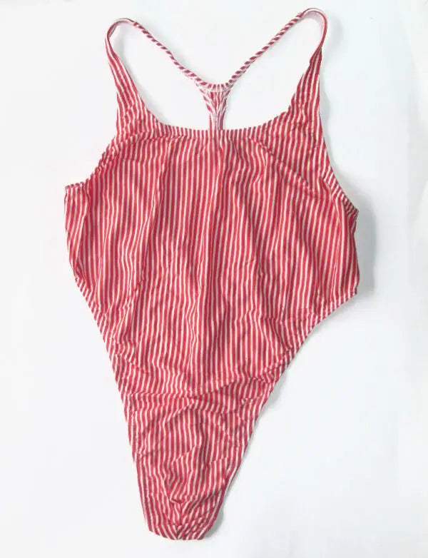red and white stripe thong bodysuit flat lay, athletic stripe, high-cut cheeky fit – pridevoyageshop.com – gay men’s harness, lingerie and fetish wear