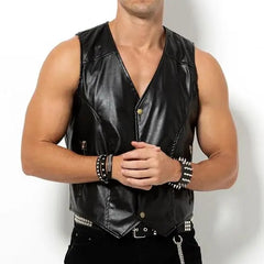 shirtless muscled gay man wearing a black barback glam vest mesh and faux leather club top standing in studio lighting showing chest shoulders and torso pridevoyageshopcom gay men’s gym tank tops mesh tank tops activewear clubwear fashion tops