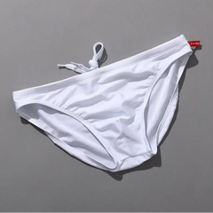 white Men’s Tease-Me Minimal Swim Briefs - pridevoyageshop.com - gay men’s sexy swim briefs, trunks, board shorts, and bikinis