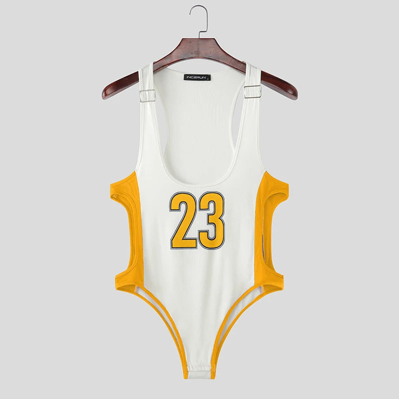 a sexy man in yellow Jock Fantasy Jersey Bodysuit with sporty mesh chest and jock-back cut, showing defined torso and bubble butt – pridevoyageshop.com – gay men’s harness, lingerie and fetish wear